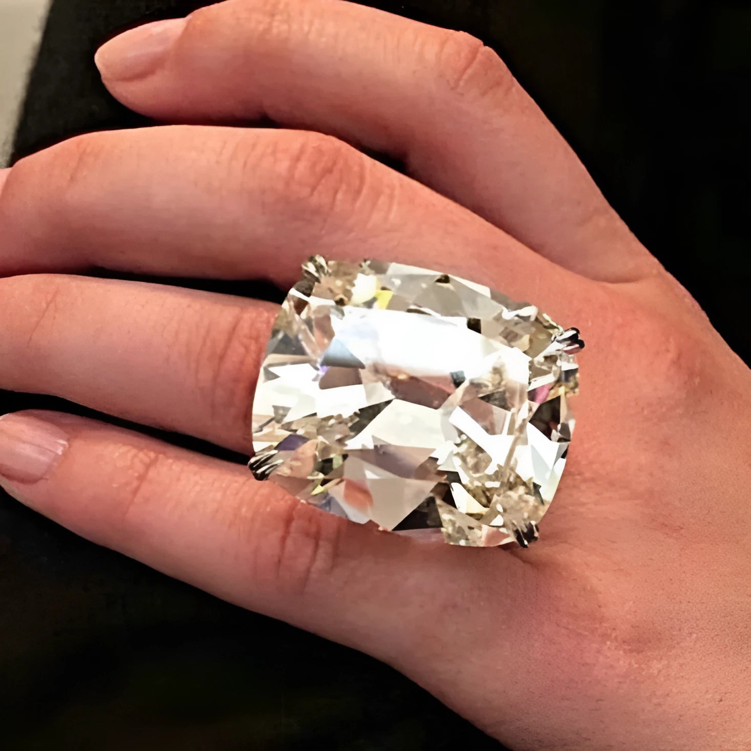 Women's white gold electroplated square diamond ring with geometric design on finger