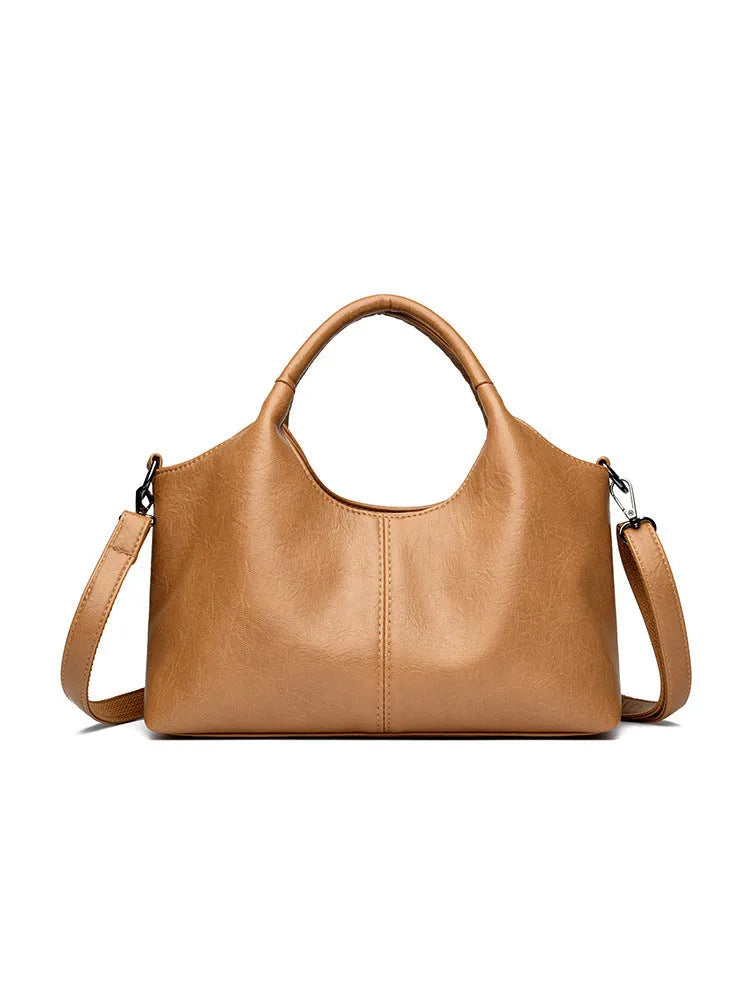 Genuine leather women's cross-body bag in multiple colours showing large capacity design