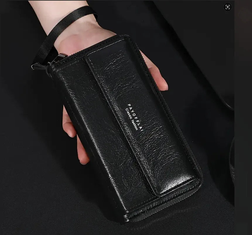 Men's black PU leather long wallet open showing multiple card slots and a zipped coin pocket.
