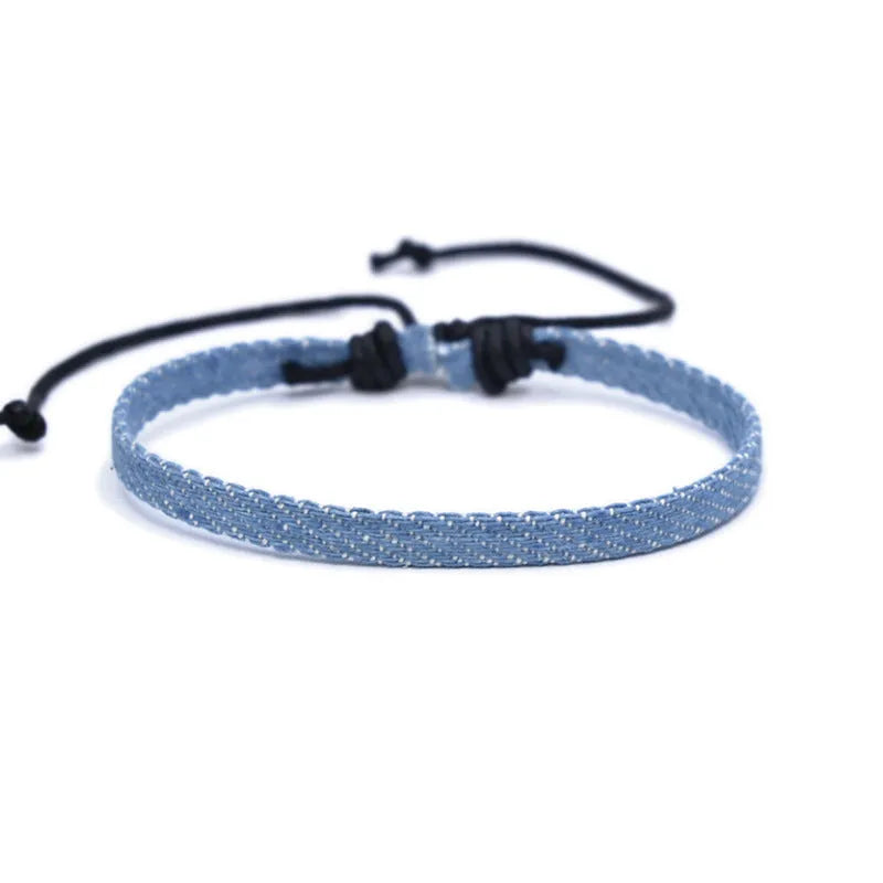 Denim fabric bracelet carrying strap with mixed materials, unisex design for travel