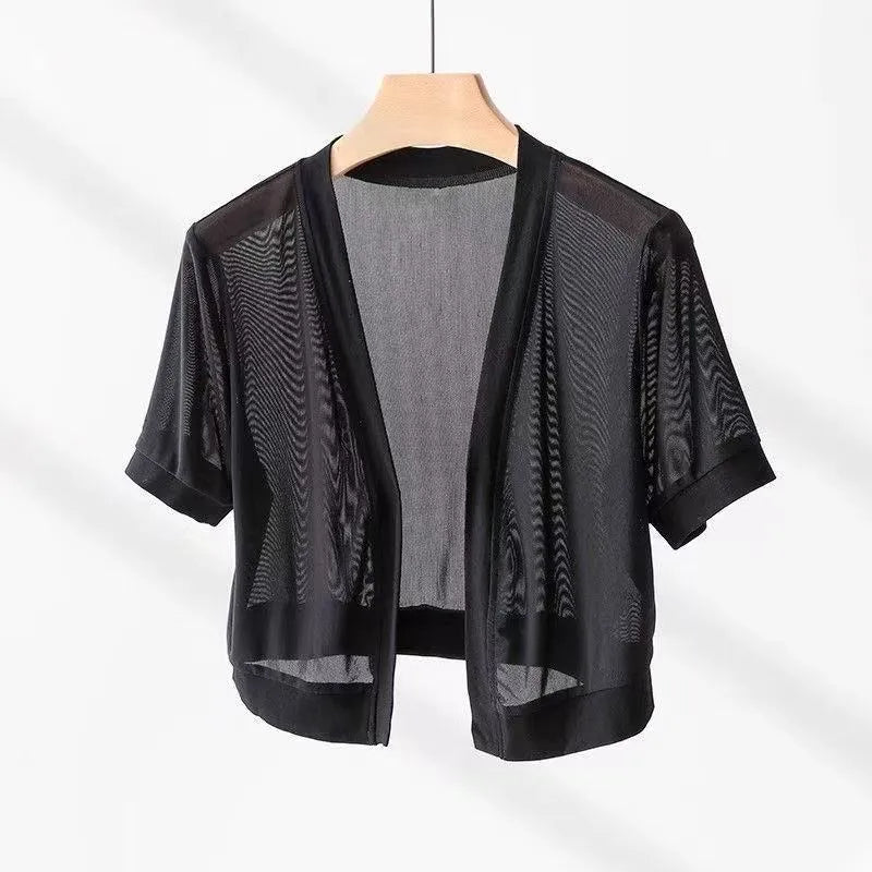 Women's black French-style shirt with irregular collar, long bell sleeves, and a tied front detail.