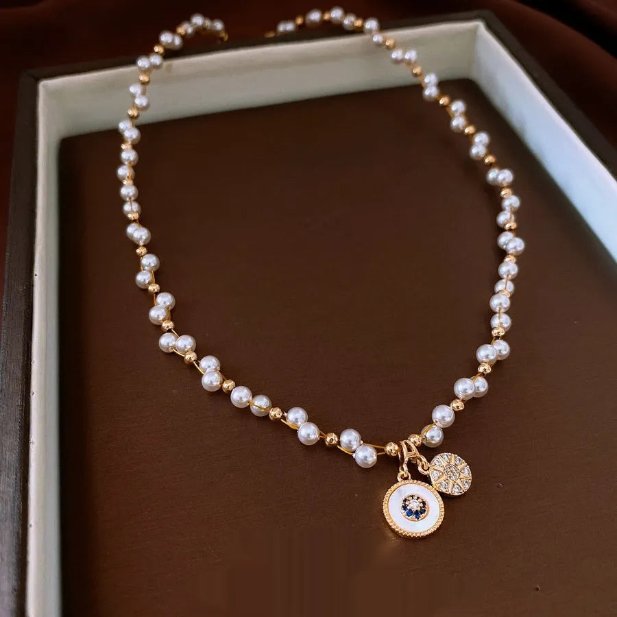 Gold electroplated pearl pendant necklace with adjustable 41-50cm clavicle chain and zircon inlaid details