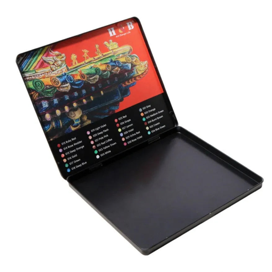 Open iron box showing 24 water-soluble coloured pencils and a brush for art projects