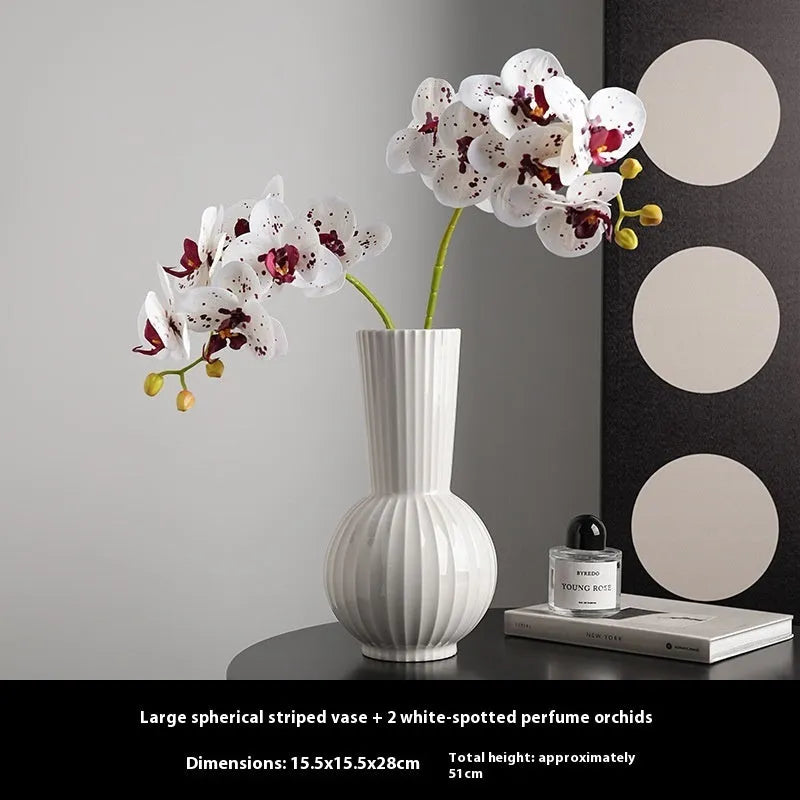 White ceramic ball vase with striped patterning in American country style on wooden table