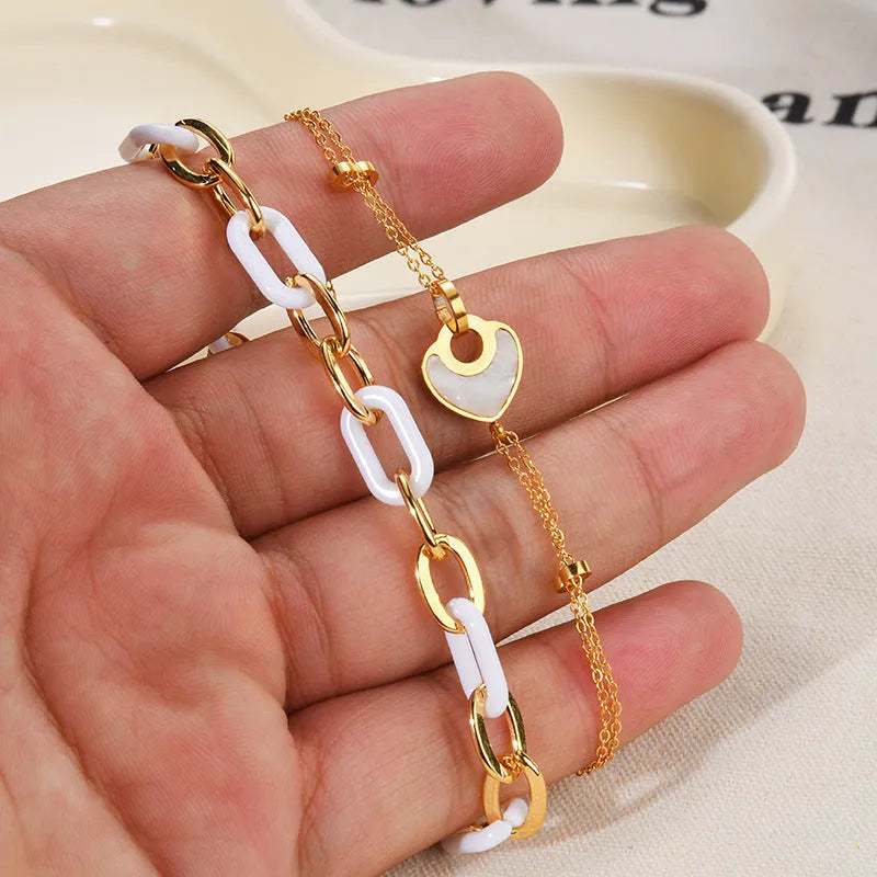Women's stainless steel resin bracelet with double layered heart design in electroplated silver colour
