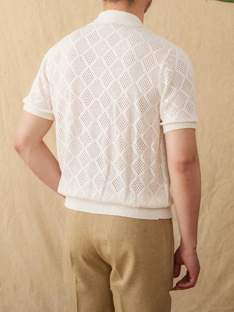 Light brown cotton short sleeve cardigan with zip front and lapel collar on a hanger