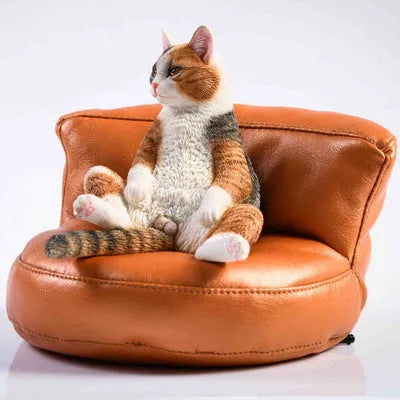 Small 7.5cm lazy cat ornament with sofa on car dashboard