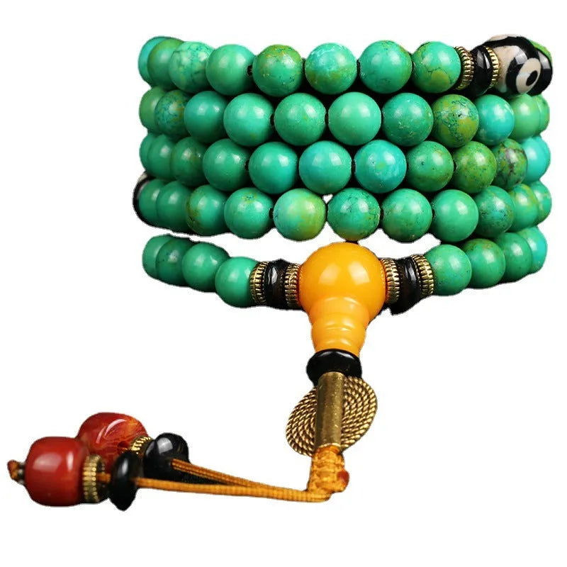 Natural raw turquoise bracelet with 108 round 8mm beads on a wrist, showing polished stone and national style design.