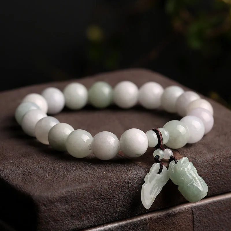 Green jade bracelet with geometric hanging beads and Maitreya Buddha charm