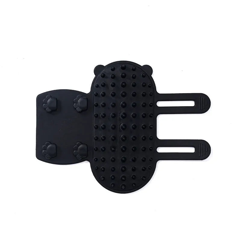 Silicone pet massage comb with adjustable strap attached to table leg