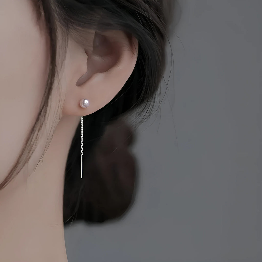 Long sterling silver needle ear string with a choice of geometric or pearl pendants for women.
