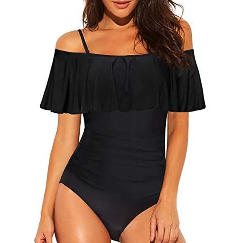 Black one-piece swimsuit with cut-out side detailing and ruffled straps