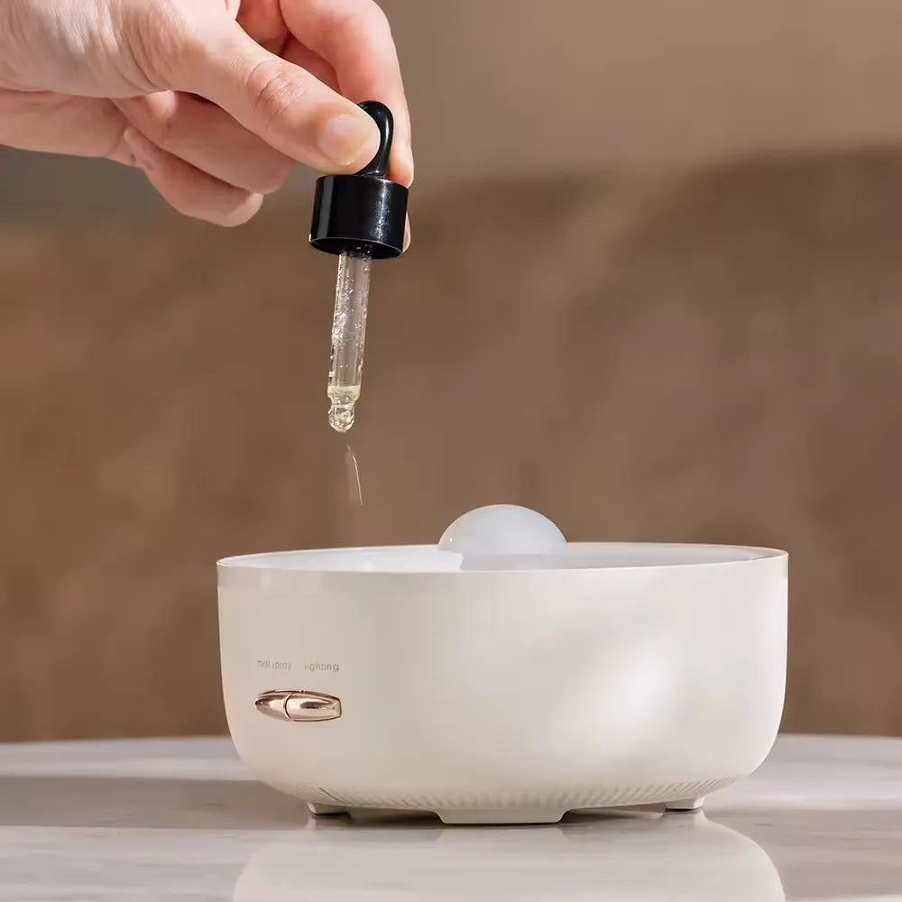 Round resin household aroma diffuser with colourful light on a desktop in beige colour