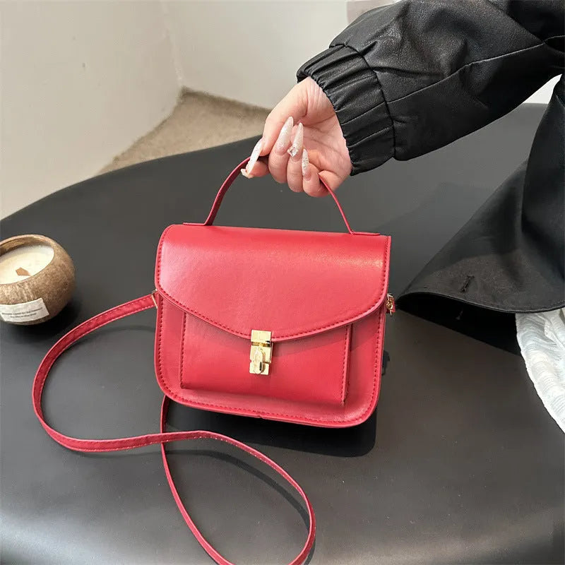 Retro style shoulder messenger bag in horizontal square shape with crossbody strap