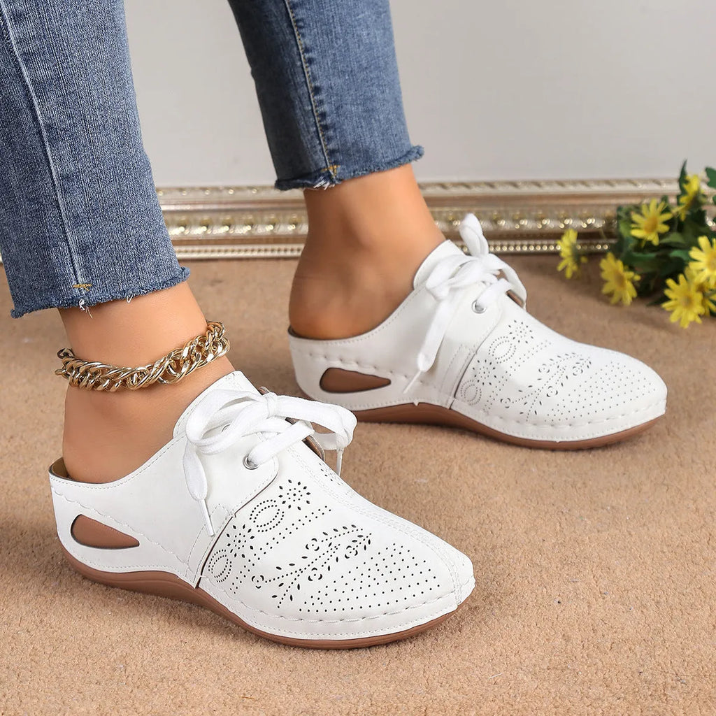 Women's lace-up Baotou slippers with hollow-out wedge design in suede material, available in multiple colours.