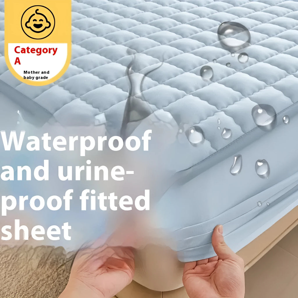 Blue washed cotton fitted sheet with quilted pattern on a bed, showcasing its waterproof protection feature.