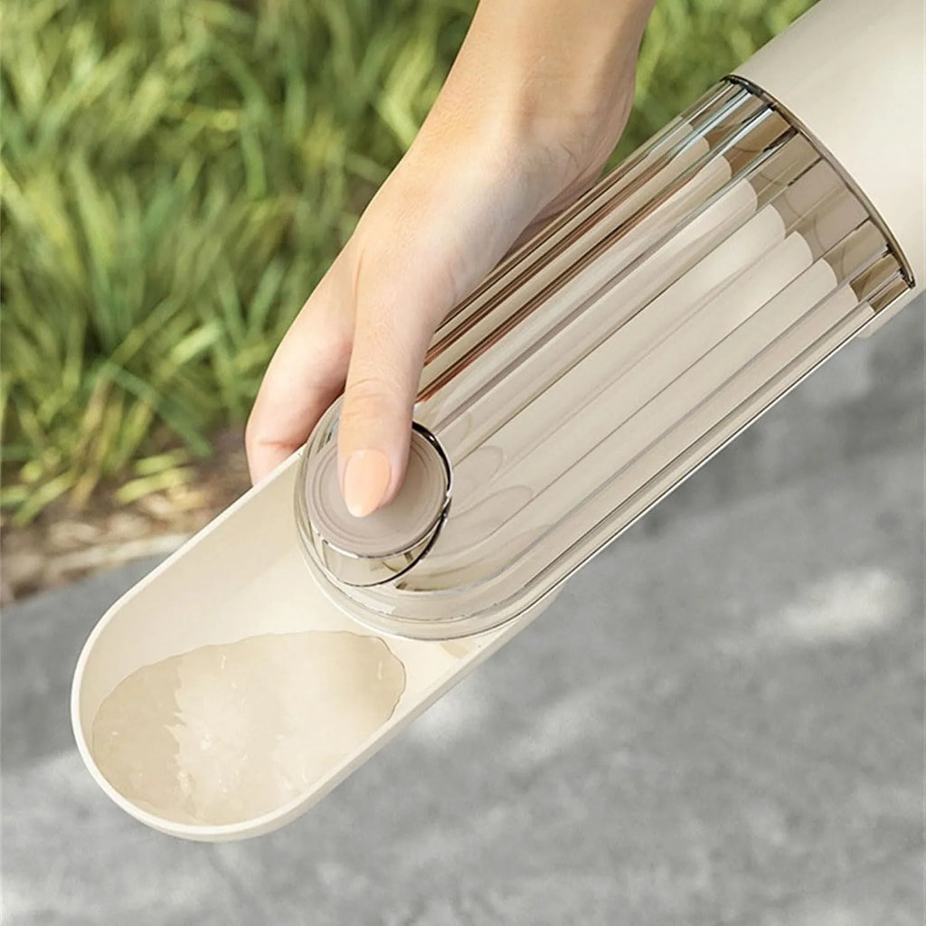 Beige foldable dog water bottle with food dispenser shown extended and collapsed for walking.