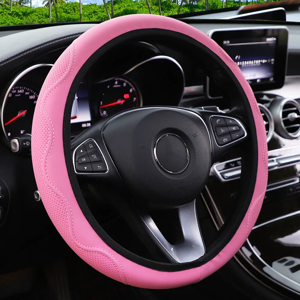 Black elastic steering wheel cover with corrugated texture, stretched to show fit on a 37-38cm wheel.