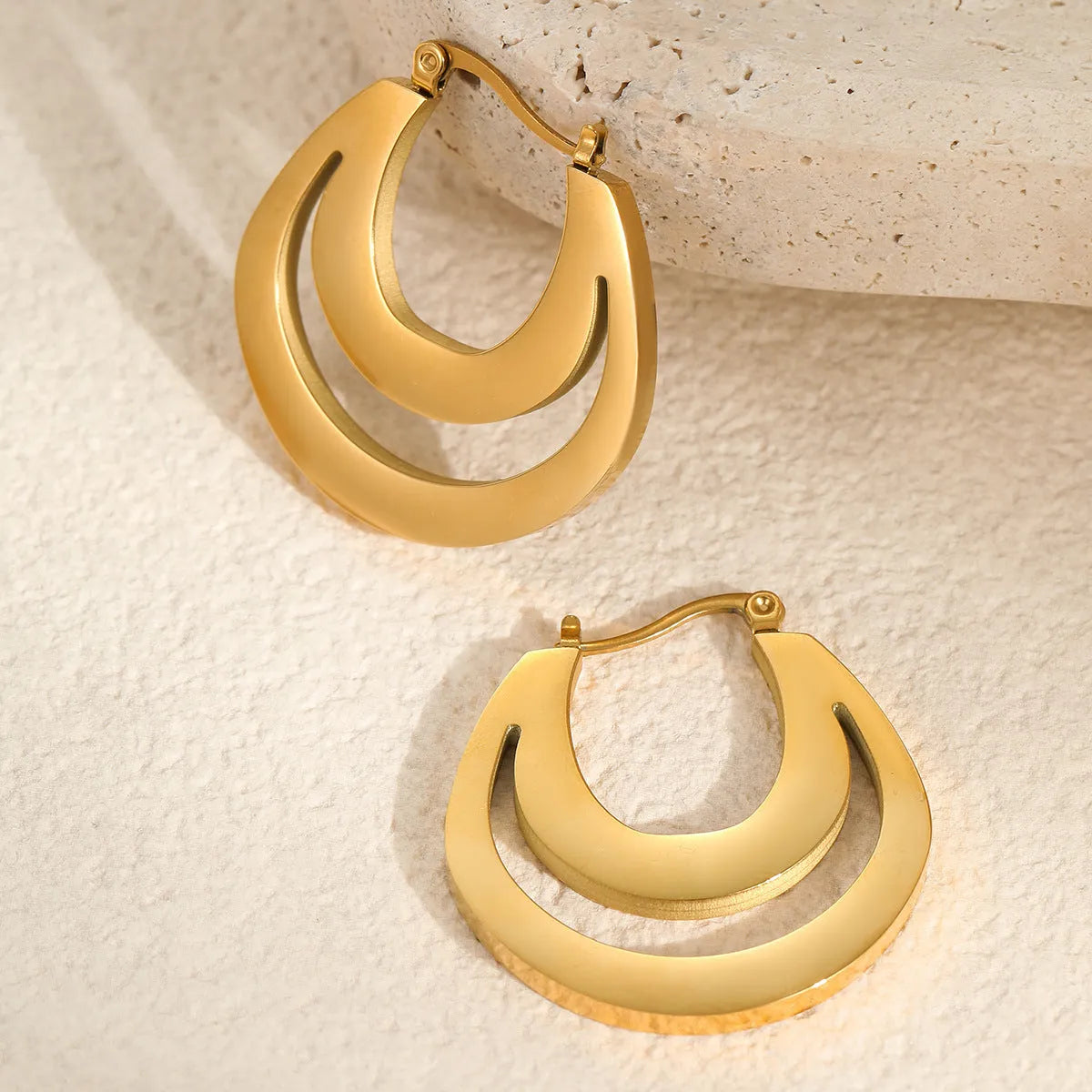 Geometric French earrings with round hoop design in gold and steel colour options