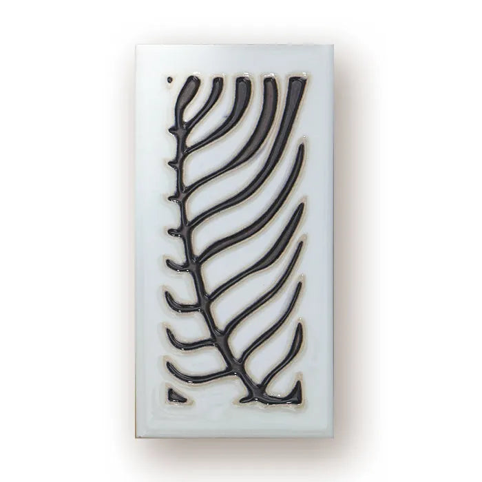 Handmade retro enamel ceramic doorplate showing a number on a glossy surface