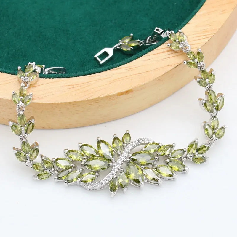 Retro floral pattern jewellery set with necklace, earrings, ring, and bracelet in olive or purple colours