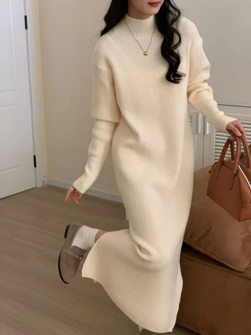 Women's knitted half turtleneck dress in acrylic with long sleeves and a high-waisted midi skirt.