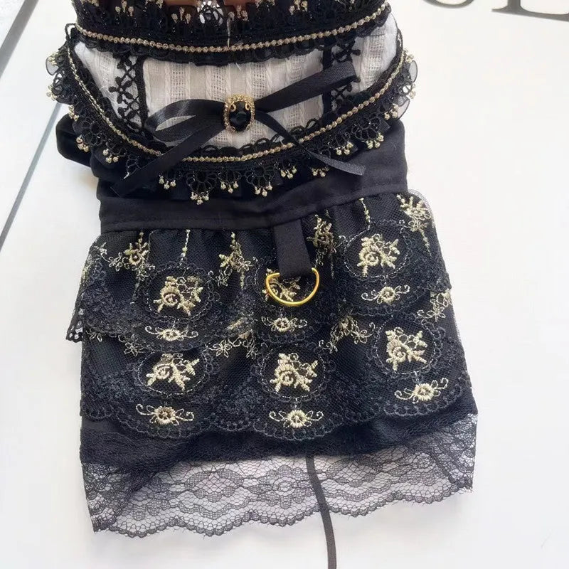 Golden polyester gothic princess style dress for a small dog on a mannequin.