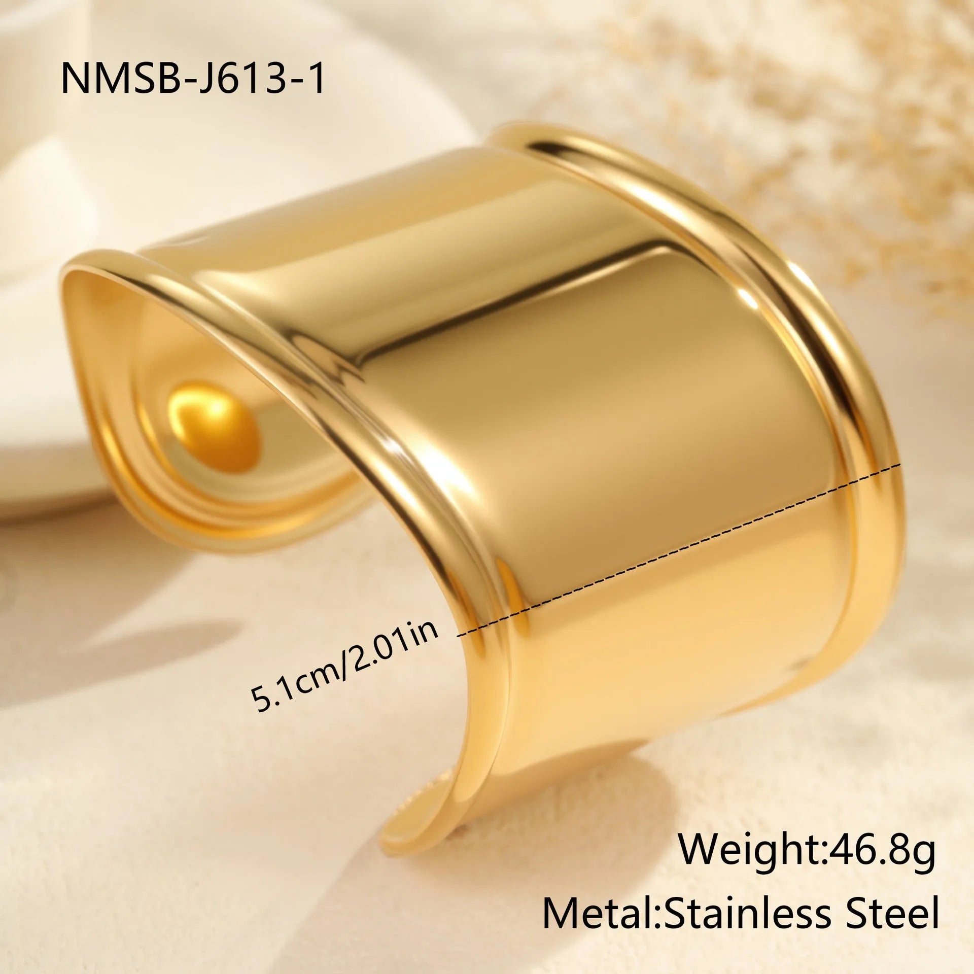 Gold plated wide stainless steel bracelet with a geometric wave shape and a niche opening.