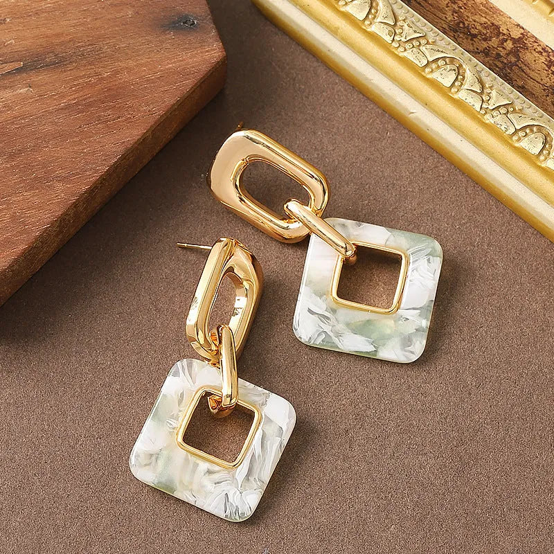 Hollow geometric square earrings with chamfered corners in silver or black