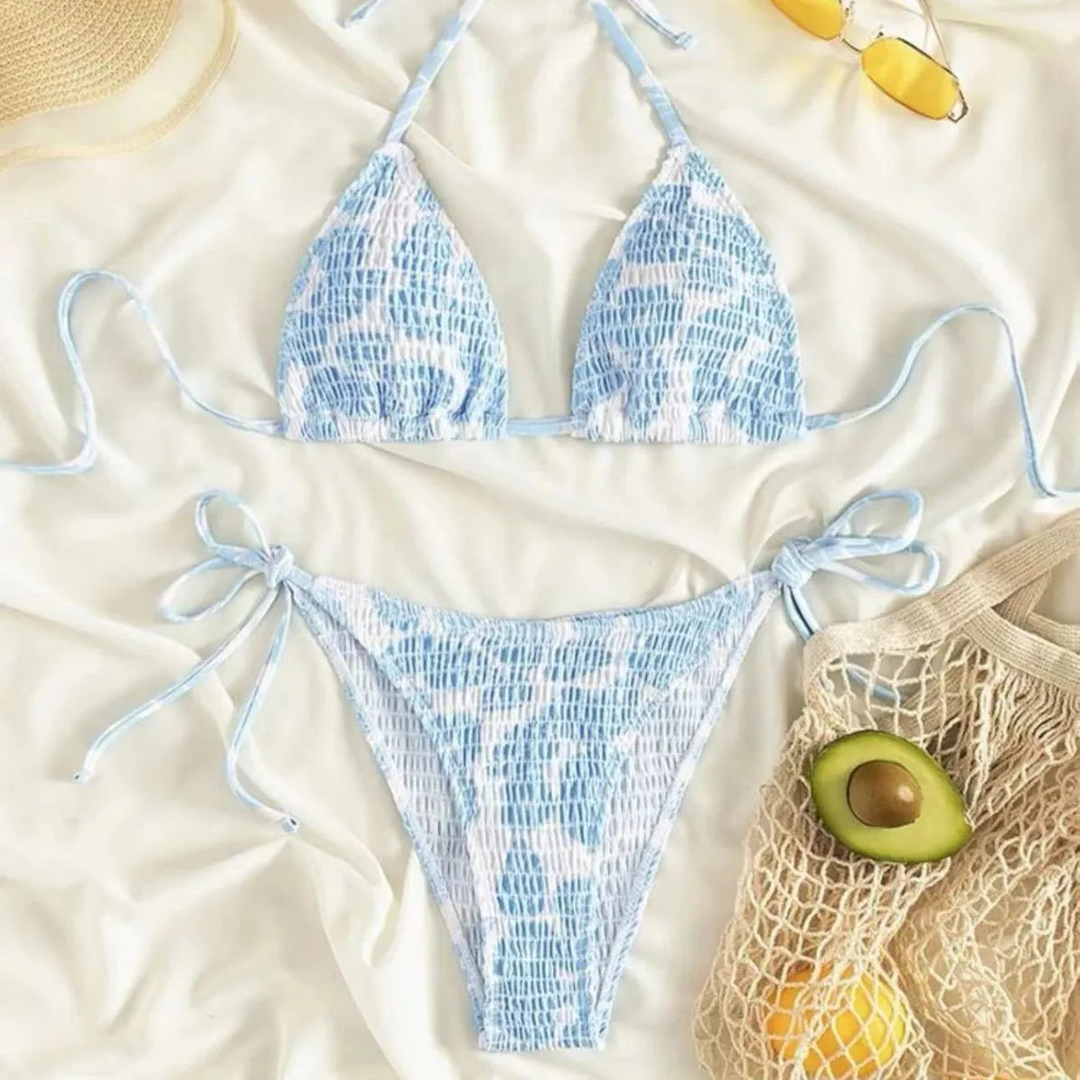 Women's floral patterned halter-neck bikini set in multiple colours on a mannequin