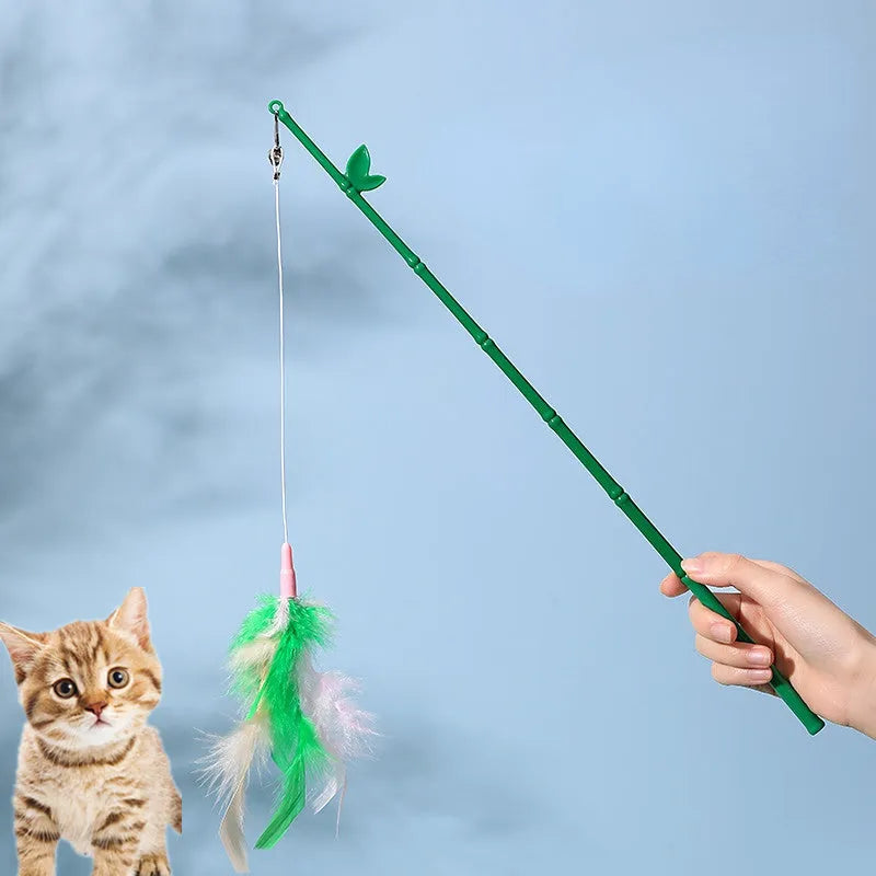 Green cat feather wand toy with bell and feather attachments for interactive play