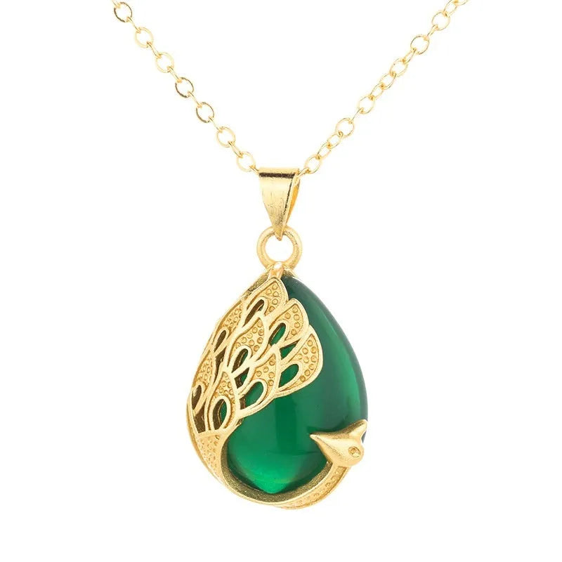 Green chalcedony imitation crystal peacock pendant on copper electroplated base with fu character element