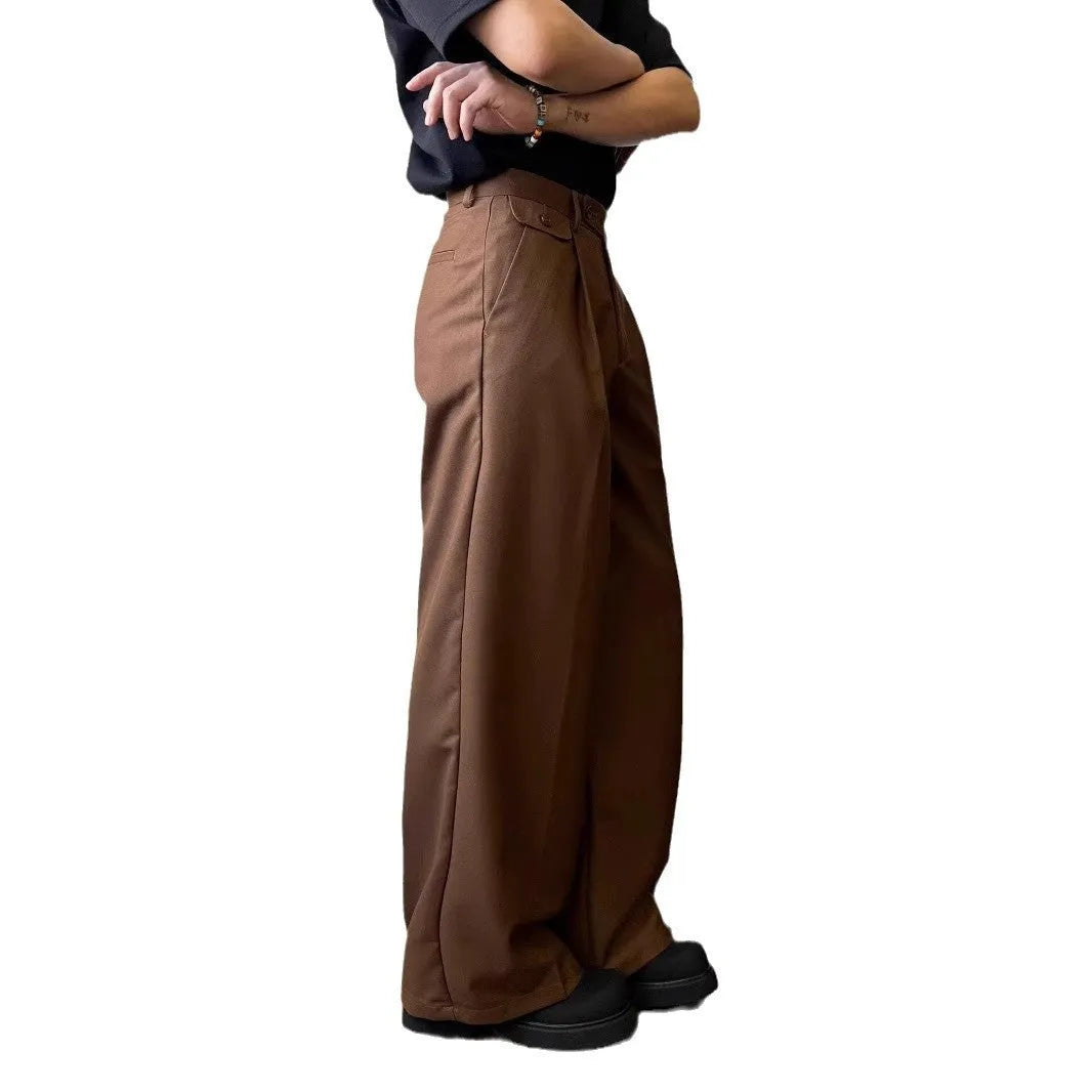 Men's straight-leg casual trousers in black with wide-leg draping silhouette on hanger