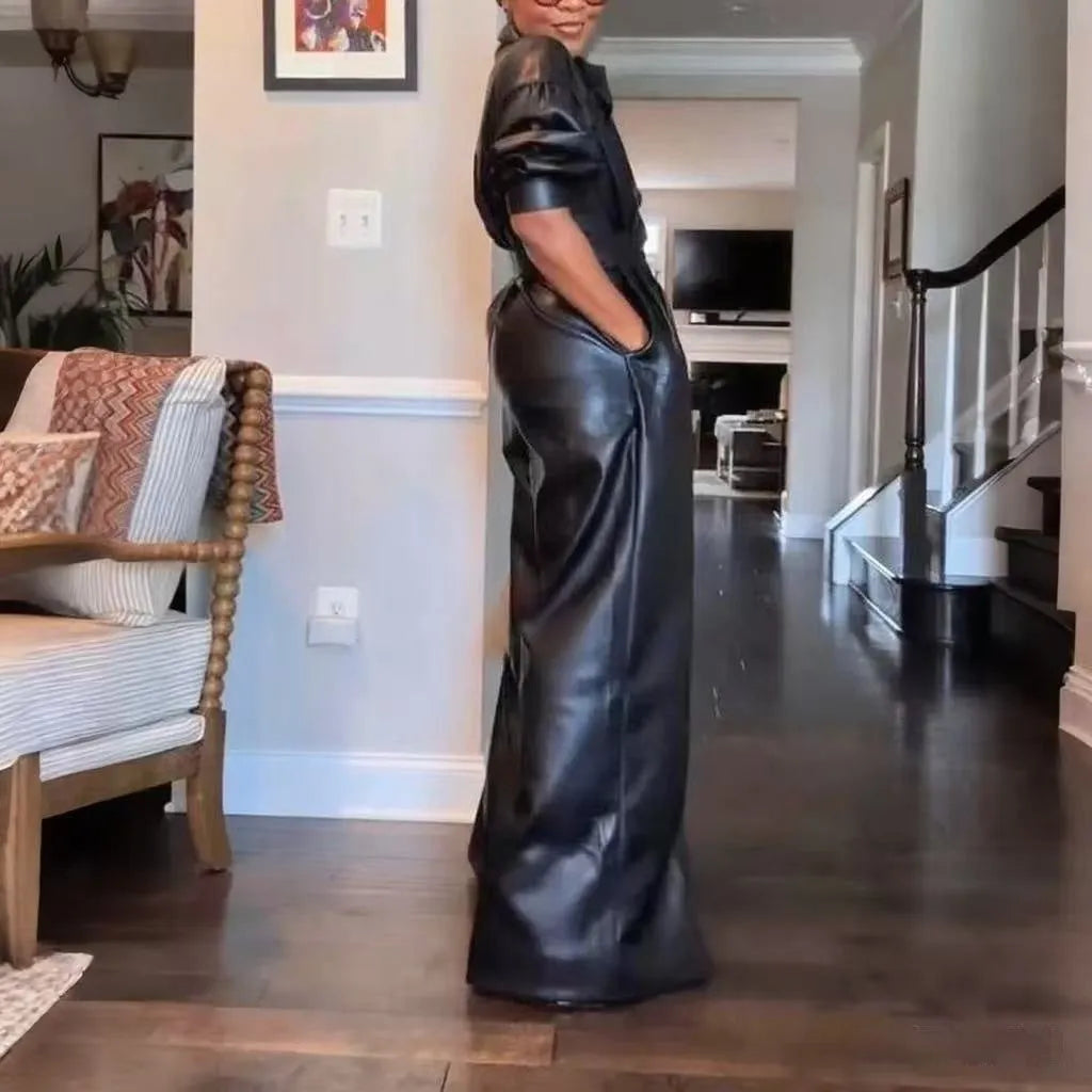 Black PU retro loose jumpsuit with puff sleeves, high waist, button front, and splicing details