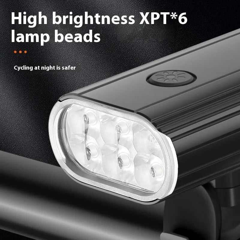 Aluminium alloy bicycle front light with 6 LEDs, USB Type-C port, and quick-release mount on handlebars.