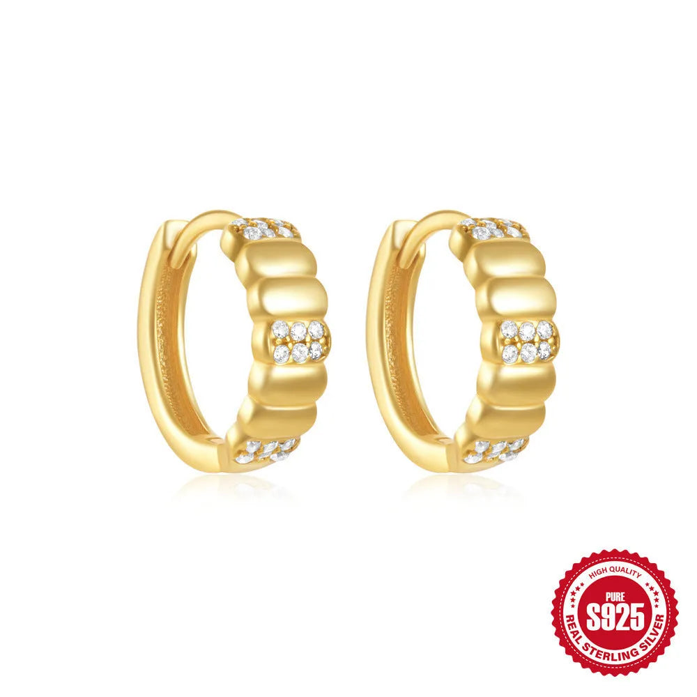 Small round geometric sterling silver stud earrings in gold and silver electroplated finishes.