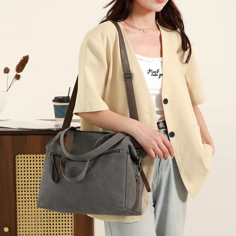 Large capacity soft canvas shoulder bag in khaki with horizontal square shape and outer sandwich pocket