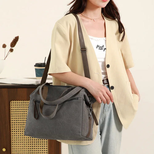 Large capacity soft canvas shoulder bag in khaki with horizontal square shape and outer sandwich pocket