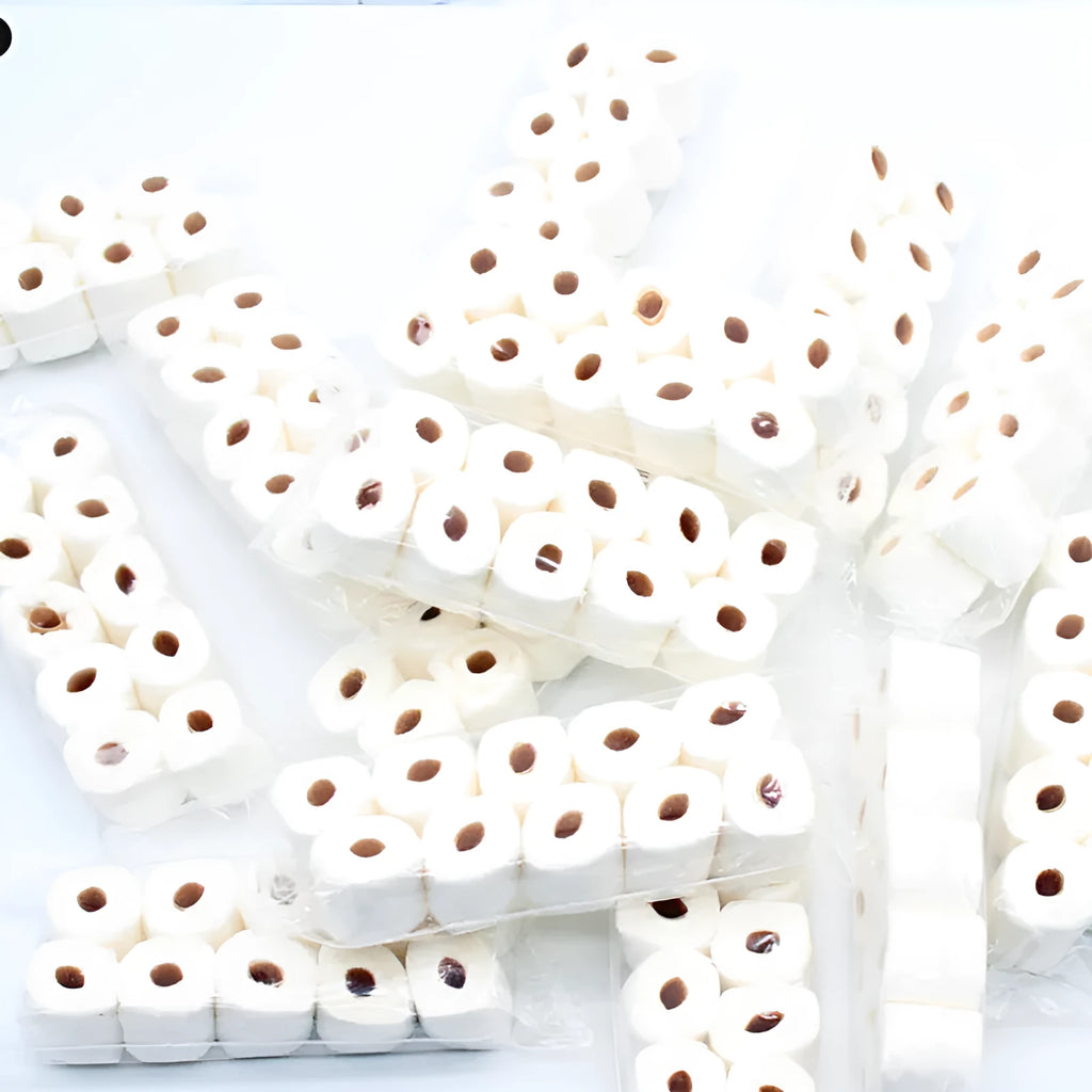 Small white simulated toilet paper roll model for children's educational toy play.