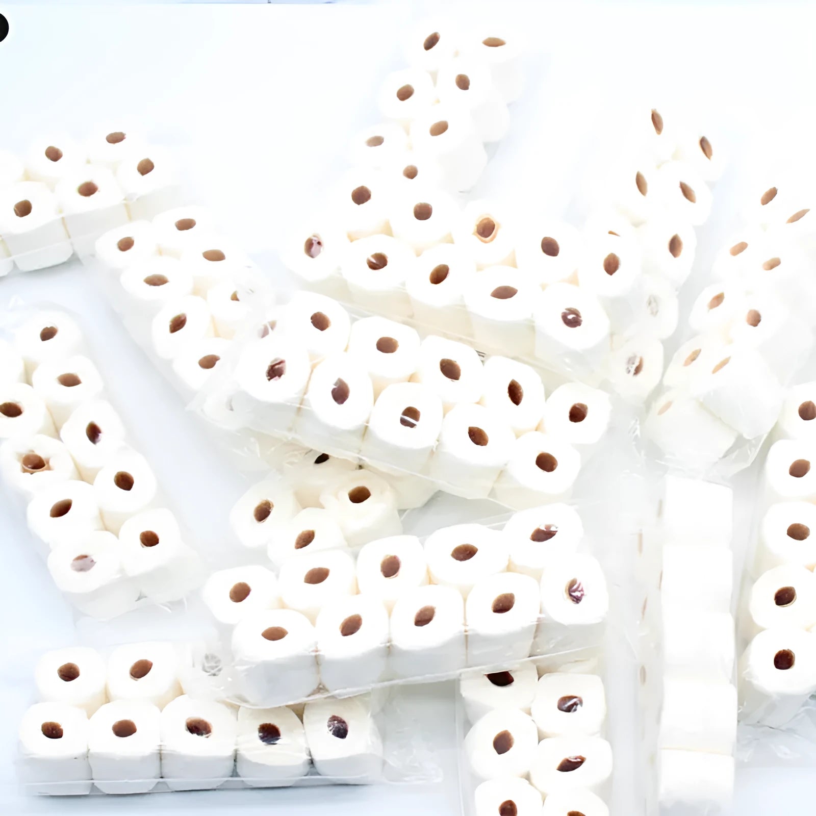 Small white simulated toilet paper roll model for children's educational toy play.