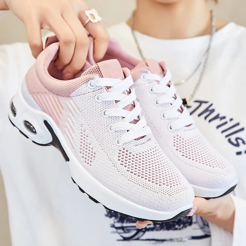 Women's Flyknit casual running shoes in a stripe pattern, showing front lace-up and round toe design.