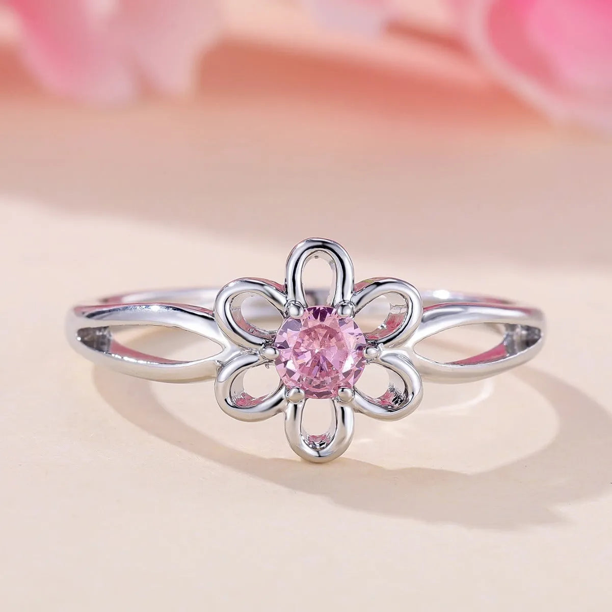 Women's hollow floral fashion ring in electroplated copper with a choice of metallic finishes.