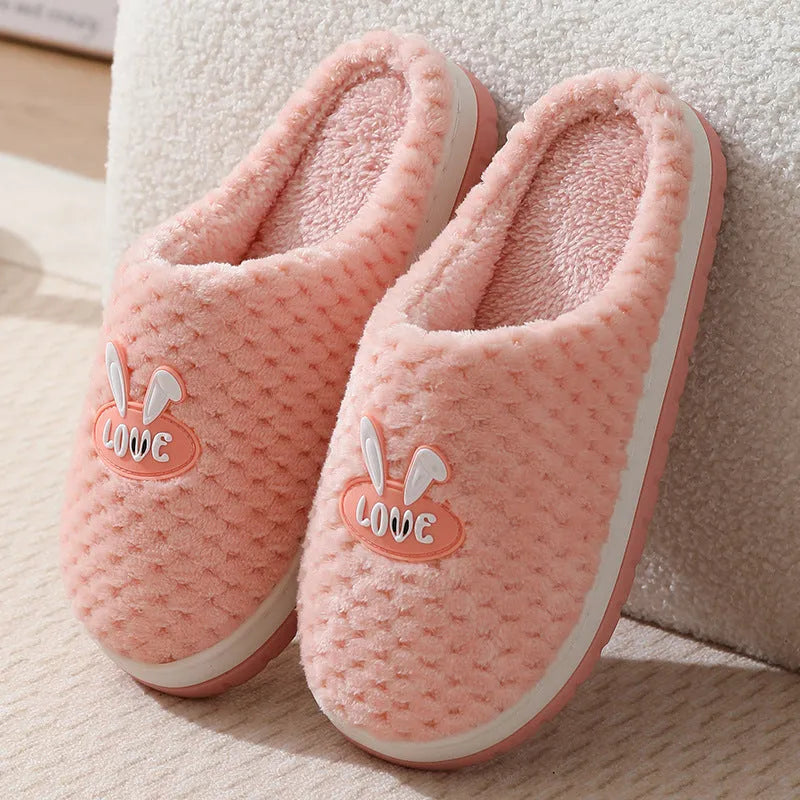 Rabbit plaid pattern women's house slippers with artificial fur upper and rubber sole.