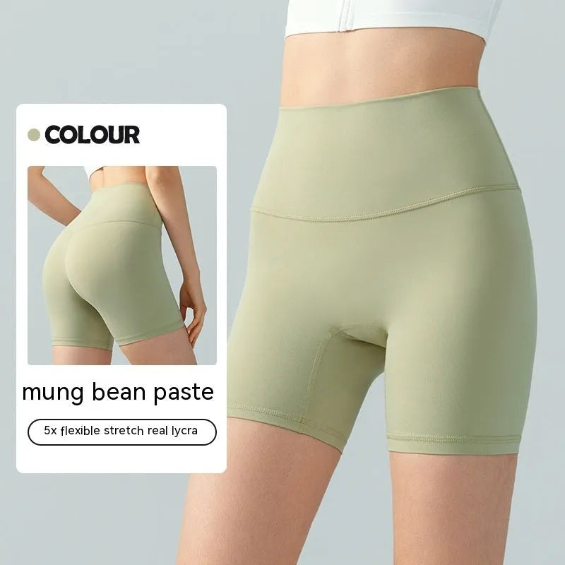 Women's lycra yoga tight shorts in leaf green colour showing high waist and short length design