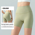 Women's lycra yoga tight shorts in leaf green colour showing high waist and short length design