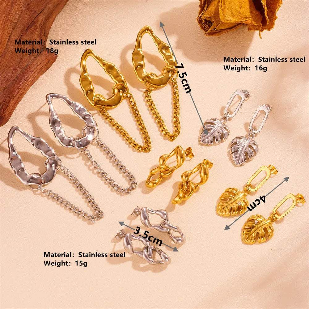 Heart shape titanium steel earrings in gold leaf style on white background