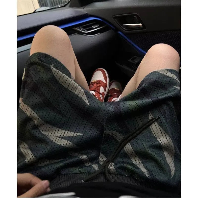 Men's camouflage print straight-leg cotton blend mesh shorts laid flat
