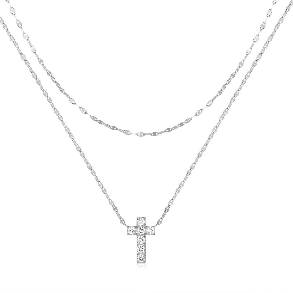 Double layer geometric twin diamond cross pendant on a sterling silver clavicle chain.