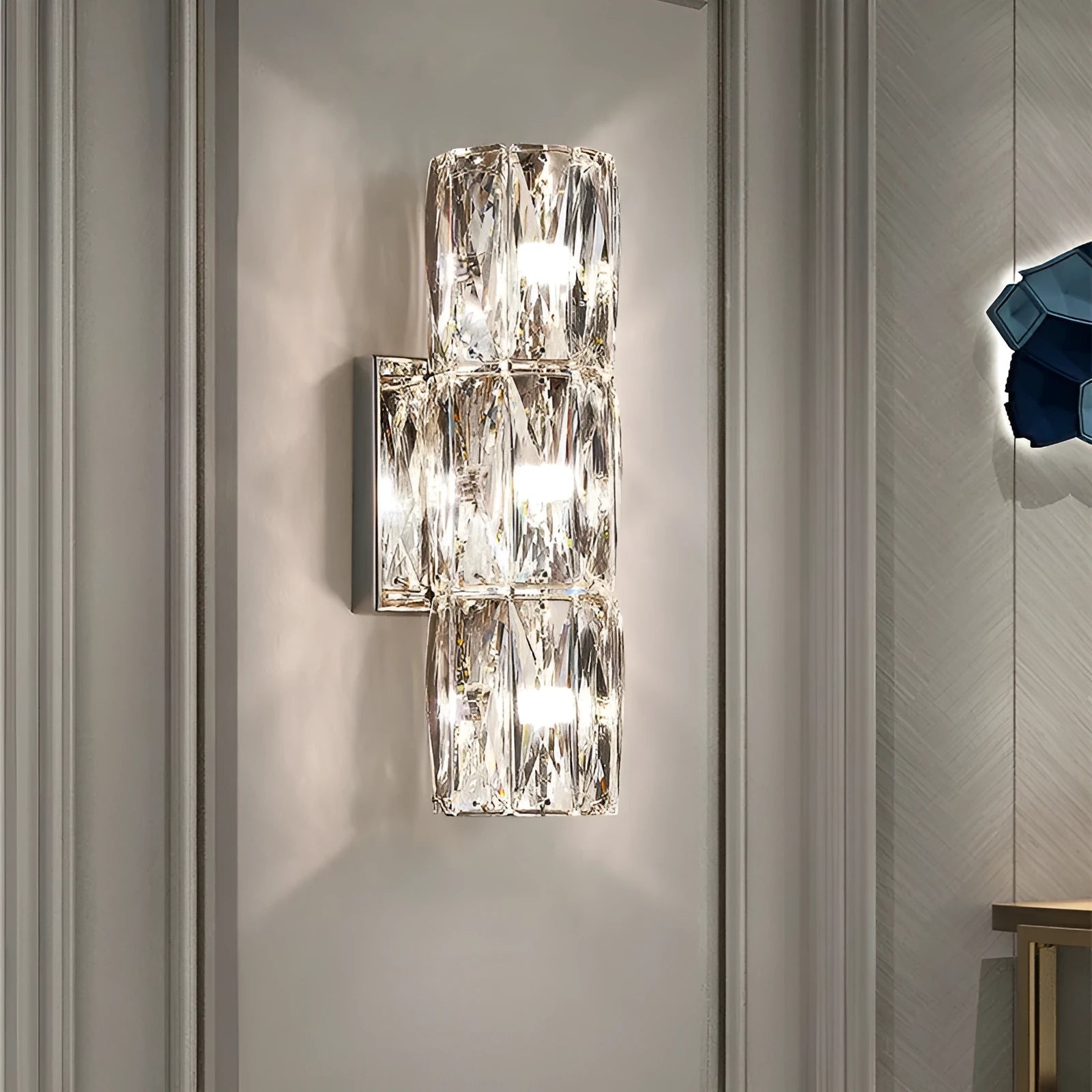 Crystal wall lamp with LED tri-colour light in chrome or gold finish showing multiple size options