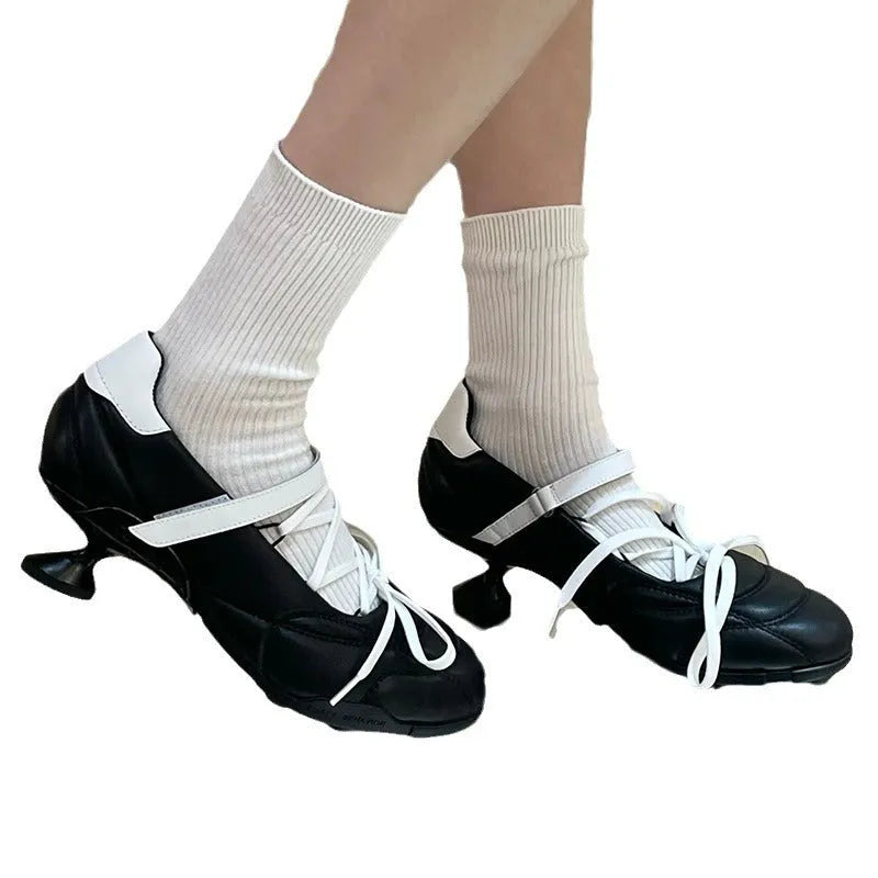 Women's silver creative lace-up bow sports shoes with mid heel and round toe on a white background.
